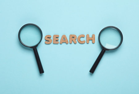 Magnifiers with word search on blue background