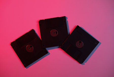 Floppy disks in neon light. Retro wave, 80sの写真素材