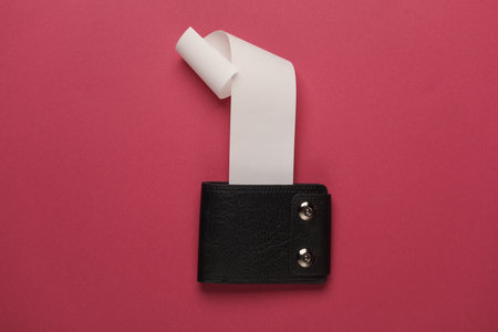 Blank Cash Receipt Sales Check and Purse on pink background