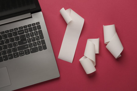 Blank Cash Receipt Sales Checks and Laptop on pink background