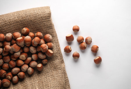 Many Hazelnuts on a sack close-up. Top view