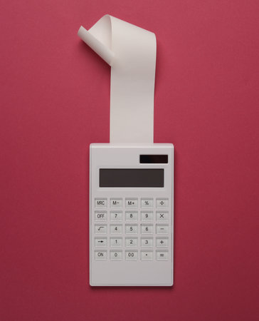 Blank Cash Receipt Sales Check and Calculator on pink backgroundの写真素材