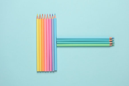 Set of colored pencils on a blue background