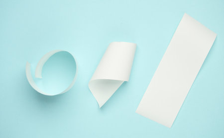 White paper roll on blue background. Top view. Flat lay.の写真素材