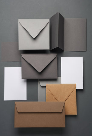 Floating envelopes and cards on dark gray background with shadow. Minimalism, modern business still...