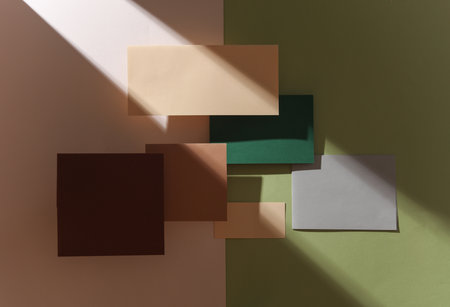 Group of floating colored blank cards sheet with shadow on beige green background. Minimalism...