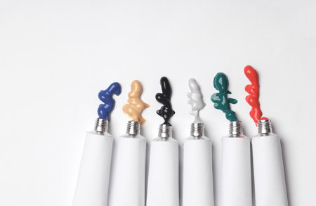 Set of White tubes of acrylic or oil paint for creativity on white background. Template for design,...