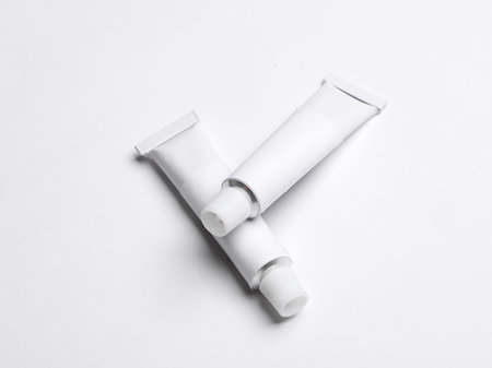White empty tubes of acrylic or oil paint for creativity on white background. Template for design, mockupの写真素材