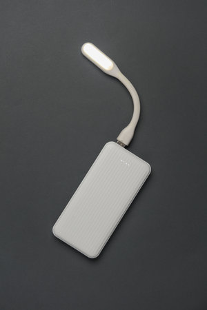 Power bank with USB lamp on a dark gray background