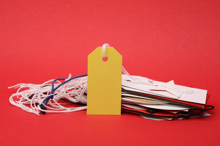 Blank price tag on red background. Sale conceptの写真素材
