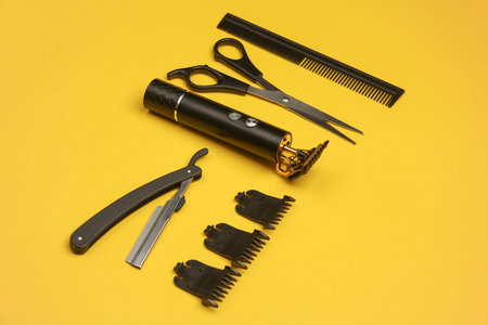 Barber working tools on a yellow background. Layout. Flat lay. Top view