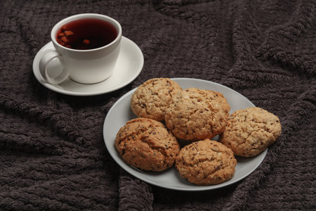 Breakfast in bed. Food on a dark blanket. Top view