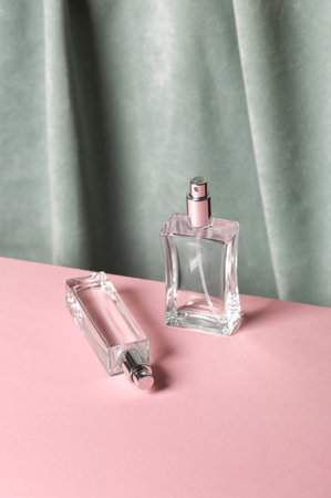 Perfume bottles against the background of curtain. Aesthetic beauty still life. Minimalism.の写真素材