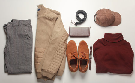 Men's clothes, shoes and accessories on a white background. Autumn seasonal clothing. Top view. Flat layの写真素材