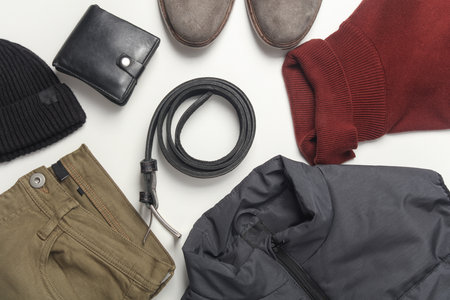 Men's clothes, shoes and accessories on a white background. Autumn seasonal clothing. Top view. Flat...