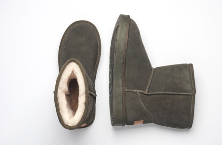 Women's suede boots with fur, white background. Top view