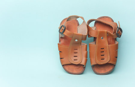 Children's sandals on blue backgroundの写真素材