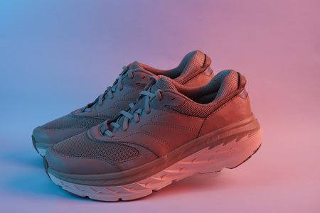 Sport shoes in neon light