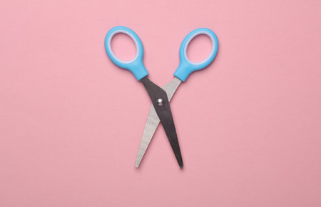 Scissors for creativity on a pink backgroundの写真素材