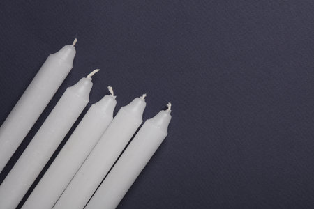 Wax candles on dark gray backgroundの写真素材