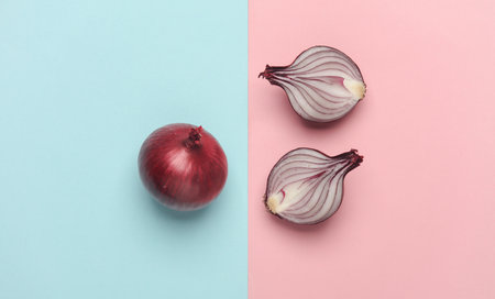 Red onion on a blue pink background. Top viewの写真素材