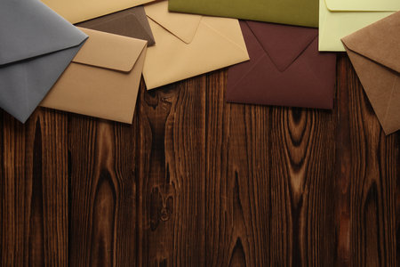 Creative layout of colored envelopes on wooden boardsの写真素材