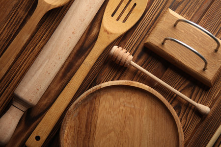 Set of wooden eco kitchen utensils on boards. Flat lay. Top viewの写真素材