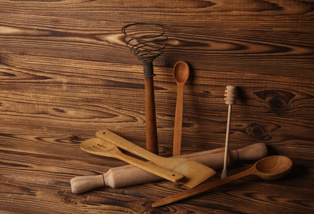 Set of wooden eco kitchen utensils on boards.の写真素材