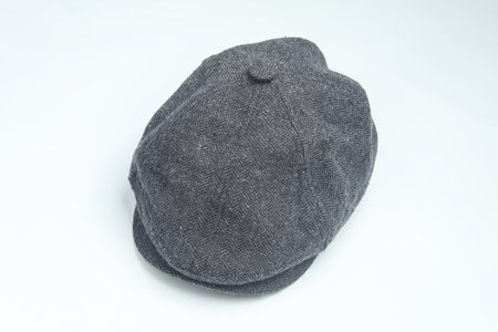 Vintage woolen English eight-piece cap on a white background