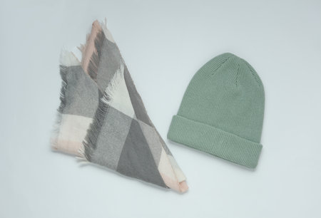 Mint green color Woolen warm winter hat with scarf on white backgroundの写真素材