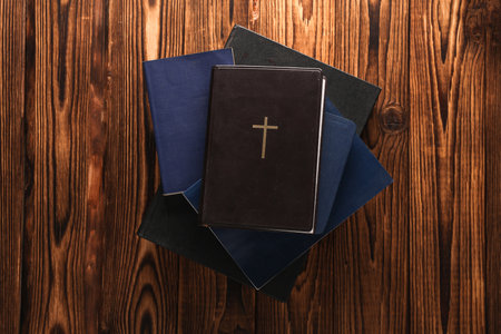 Many Holy Bible books on a wooden table. Christian religionの写真素材