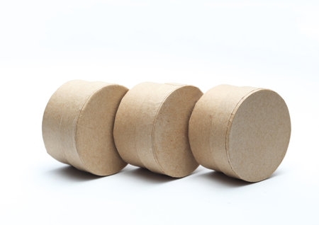 Round craft cardboard boxes for product on white background