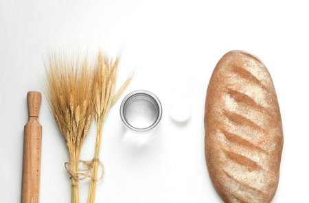 Bread with Cooking ingredients and kitchen utensils on white background. Top view. Flat layの写真素材