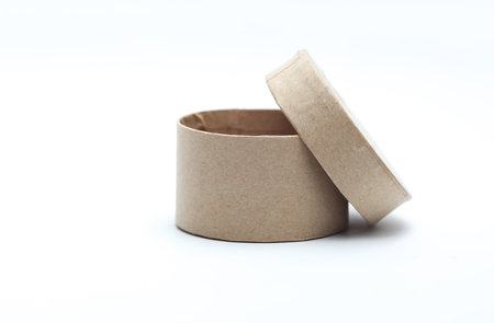 Round craft cardboard box for product on white background