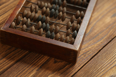 Close up of wooden abacus on wooden table