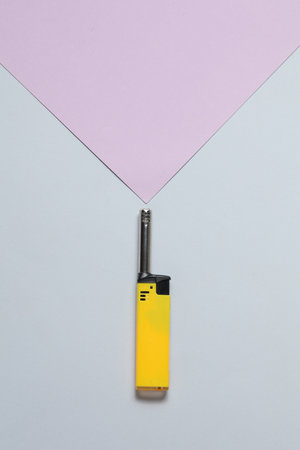 Household lighter on a pastel background. Top viewの写真素材