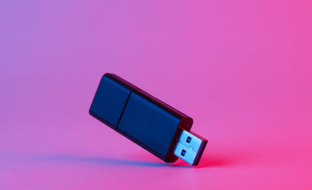 Usb flash drive in blue-pink gradient neon lightの写真素材