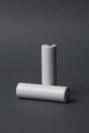 AA batteries on a dark gray background. Mockup for designの写真素材
