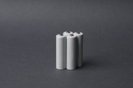 AA batteries on a dark gray background. Mockup for design