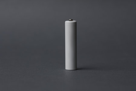 AAA battery on a dark gray background. Mockup for designの写真素材