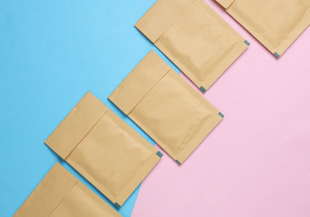 Shipping Post Parcel Envelopes on Pink Blue Background