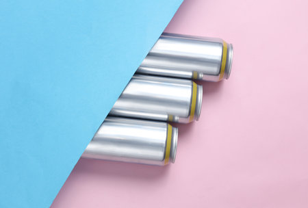 Metal tin can of beer on a blue-pink pastel background. Top view