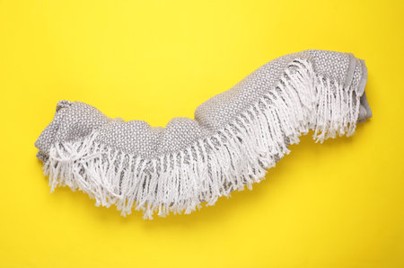 Gray fabric plaid on yellow background. Top viewの写真素材