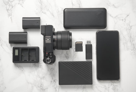 Modern equipment and accessories of a photographer on a marble background. Flat layの写真素材