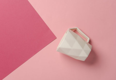 White geometric cup on pink background. Top viewの写真素材