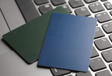 Credit cards on laptop keyboard close-up