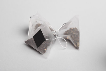 Tea bag Pyramid on gray background
