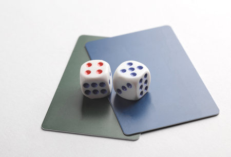 Credit cards with dice on a white background