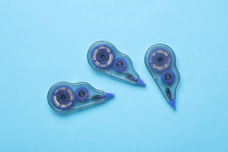 Tape correctors on pink background. Top view