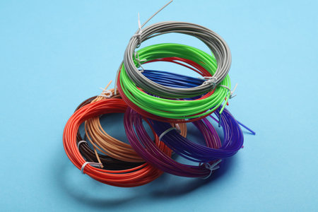 PLA plastic for 3D pens on a blue background